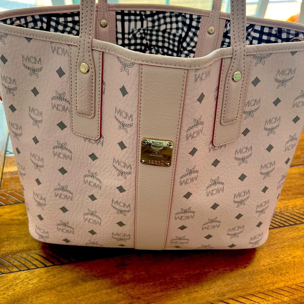 Like New 2022 NCM pink Tote and wristlet. Only used a few times.